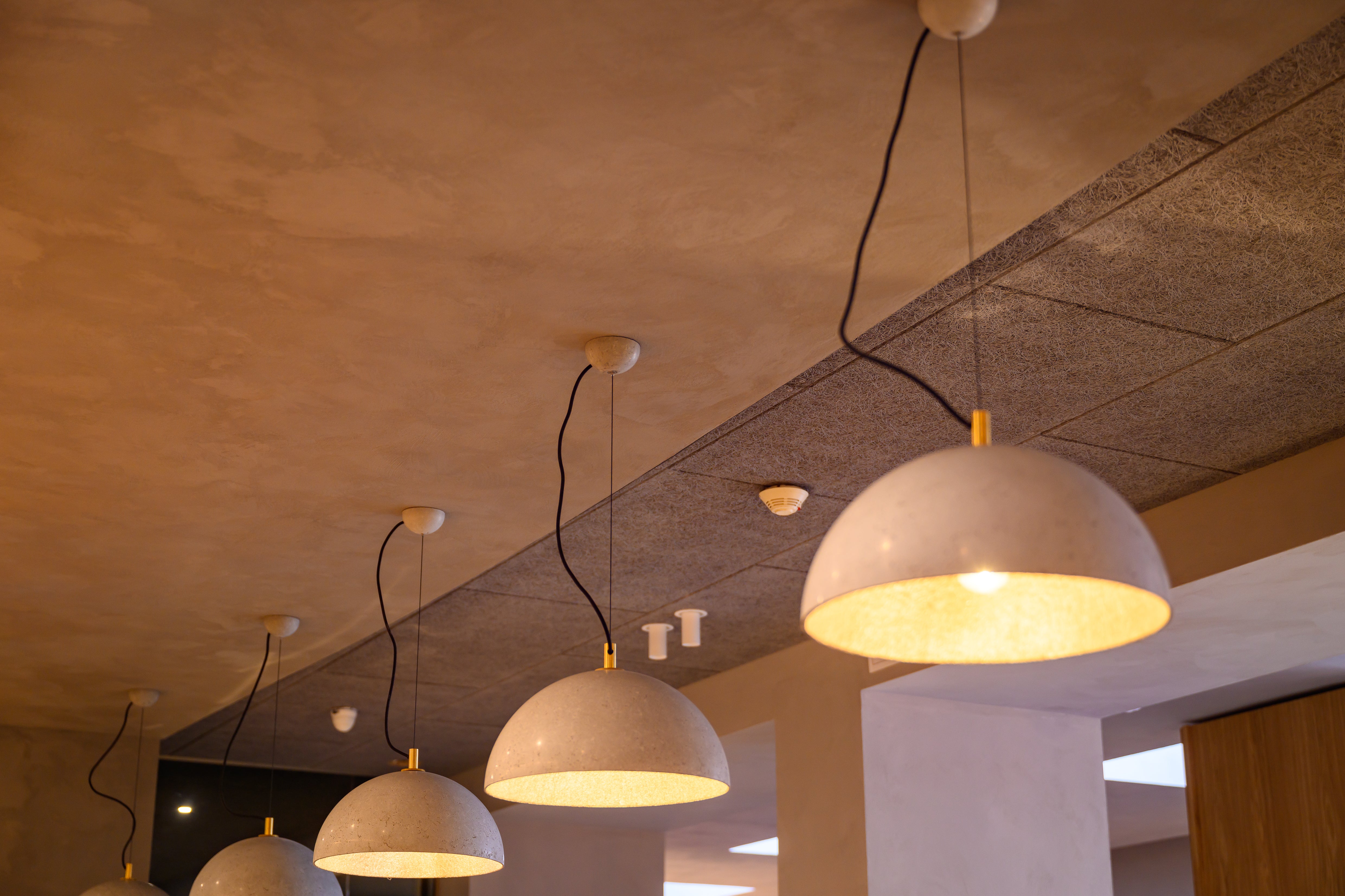 KULTA Limewash Paint, an eco-friendly mineral paint known for its natural matte texture. Hotel Restaurant Interior Design.